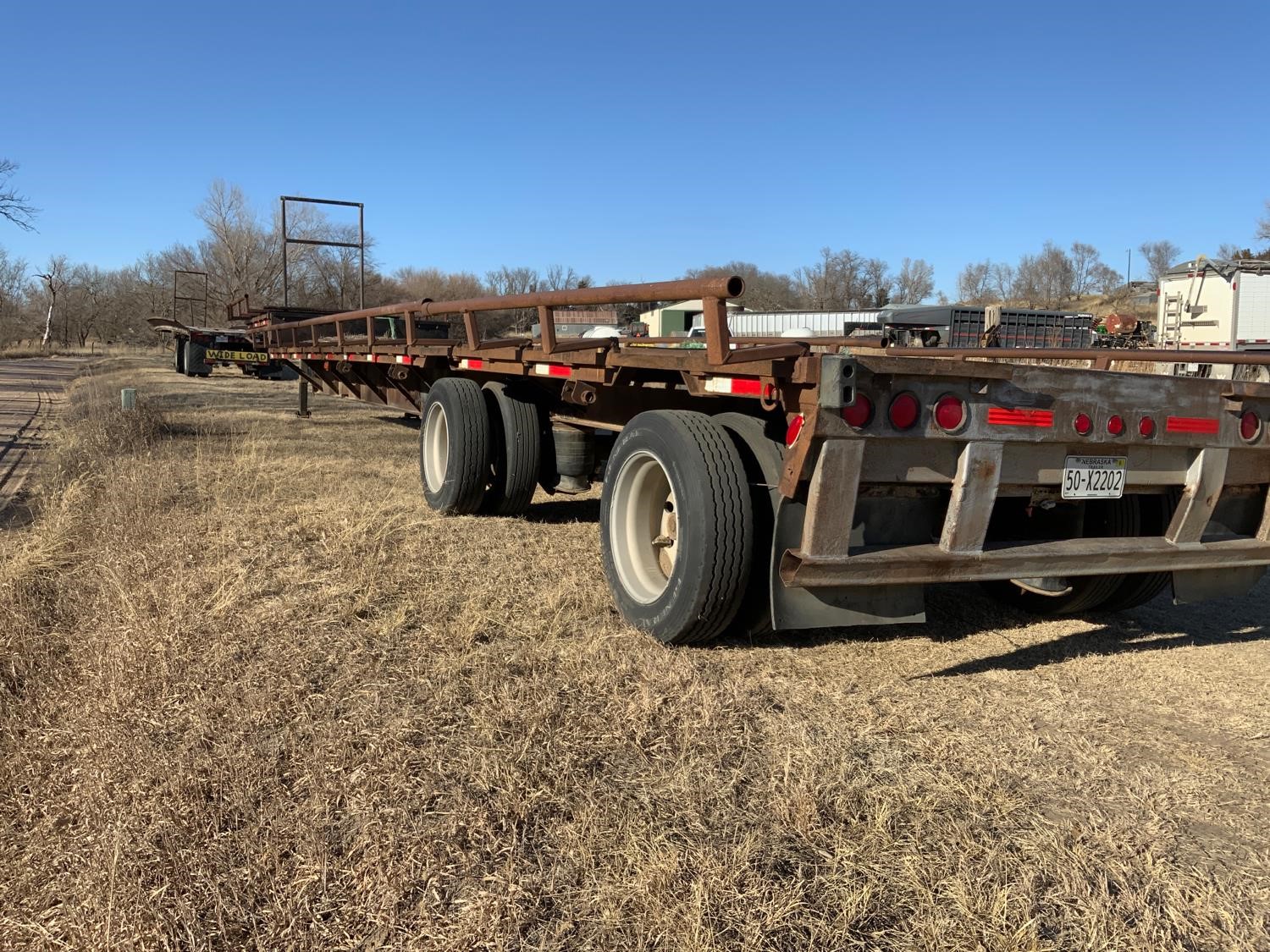 1999 Aztec 48’ T/A Flatbed Trailer BigIron Auctions