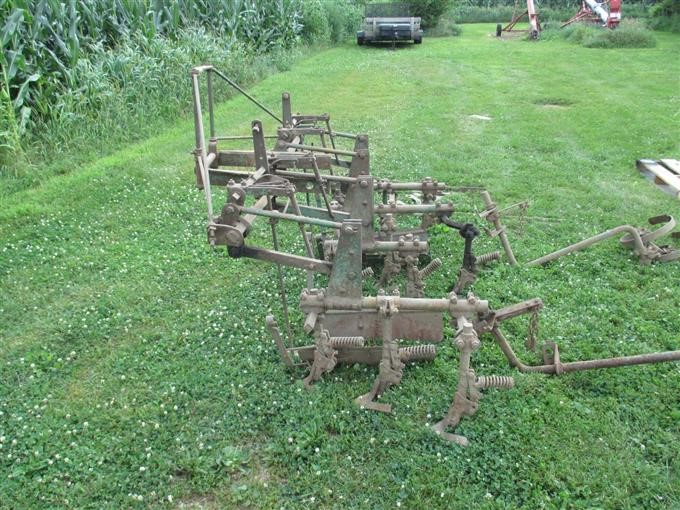 John Deere Logo on Antique Cultivator Shield