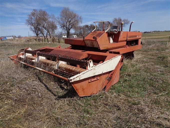 hesston 1014 windrower plugs up constantly