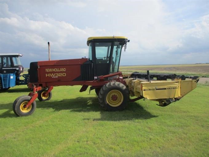 1999 New Holland HW320 Swather BigIron Auctions