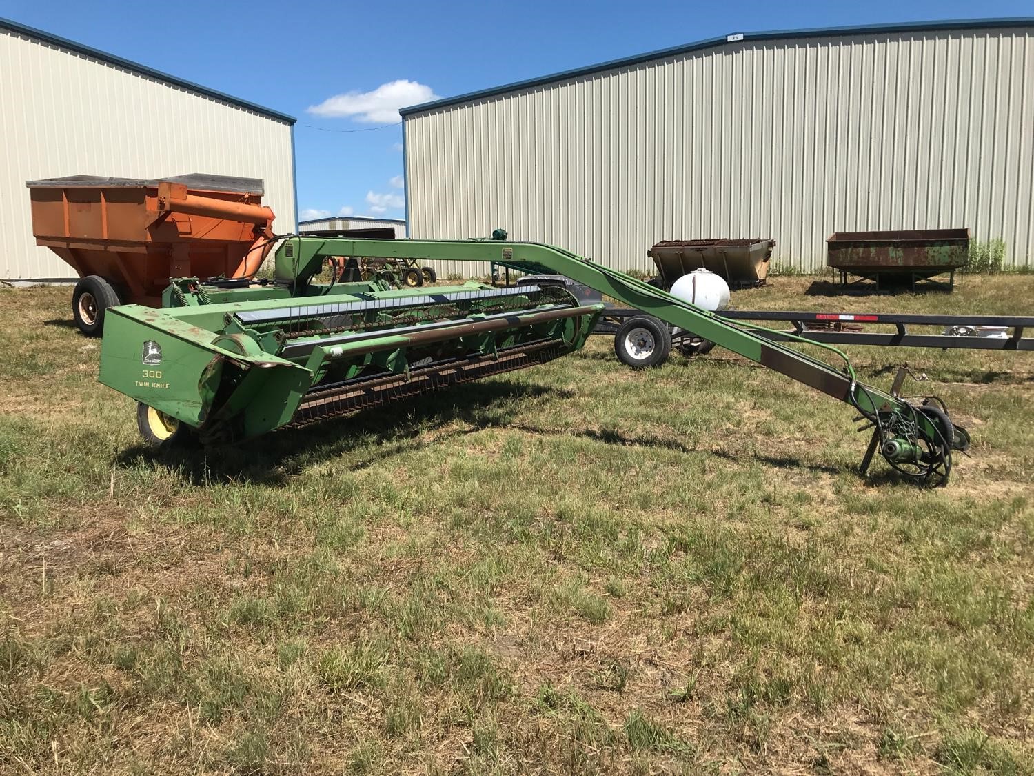 John Deere 300 Swather BigIron Auctions