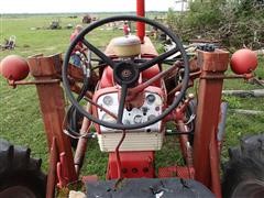 items/14cdddf28224e41180be00155de252ff/internationalfarmall460tractorwdualloader