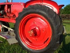 items/3cbd9c747229e41180be00155de252ff/1946-1948masseyharris20tractorwithbellymower