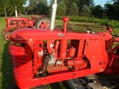 items/3cbd9c747229e41180be00155de252ff/1946-1948masseyharris20tractorwithbellymower