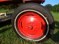 items/3cbd9c747229e41180be00155de252ff/1946-1948masseyharris20tractorwithbellymower