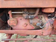 items/4b7c62605529e41180be00155de252ff/1950mccormick-deeringw9tractor