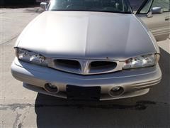items/547a05519545e41180bf00155de1c209/1997pontiacbonnevillessei4doorsedan