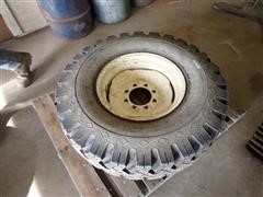 11.00-20 Studded Tire W/8 Bolt Rim 