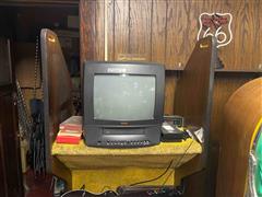 Gm Video Center With TV And Miscellaneous Items 