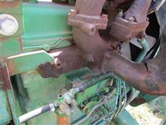 items/7cb198f8973fee11a81c000d3a61c84b/1988johndeere1050mfwdtractor-3_3aad4db31348470baddee05ed76e5c1e.jpg