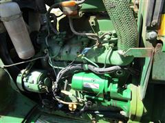 items/7cb198f8973fee11a81c000d3a61c84b/1988johndeere1050mfwdtractor-3_91a0291f5a9b473fbb4a3cb3444fdeea.jpg