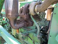 items/7cb198f8973fee11a81c000d3a61c84b/1988johndeere1050mfwdtractor-3_b2ac301e547c4801963c04e7262b33d3.jpg