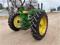 items/8496d98093abec11bea100155d423d41/1956johndeere702wdtractor-2_8f0d330874e146bf9b3d927f2aa24188.jpg