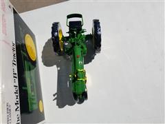 items/8bcc4779f9e6ed11a81c6045bd4cc723/ertljohndeeremodelbmodel630tractormodeltoy_35bc3ada885f406f88da3a3a05e488dd.jpg