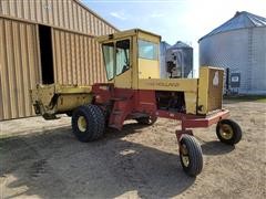 items/c4ddcf73c99eeb1189ee00155d424509/newholland1116windrower-2_f922f185405f453cb9da78d569f8b62a.jpg