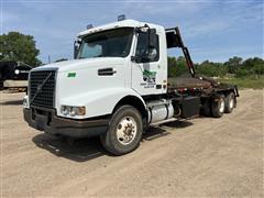 2006 Volvo VHD T/A Roll-Off Truck 